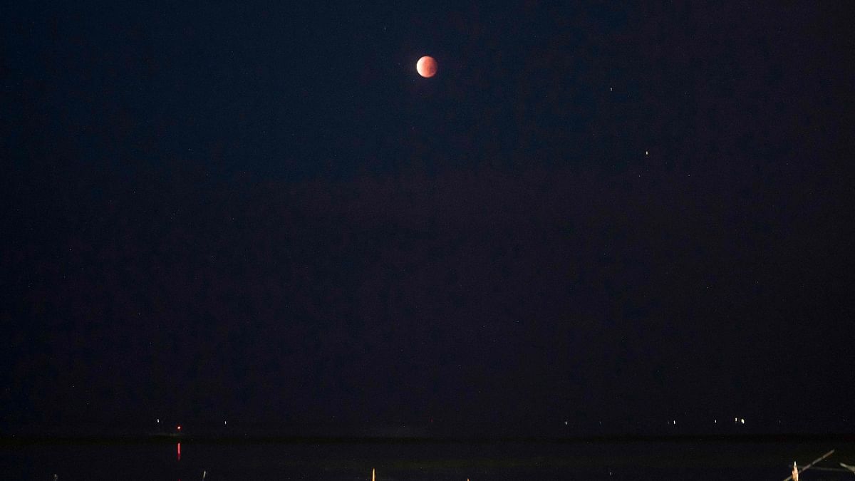 The moon is pictured above Surabaya on May 26, 2021. Credit: AFP Photo