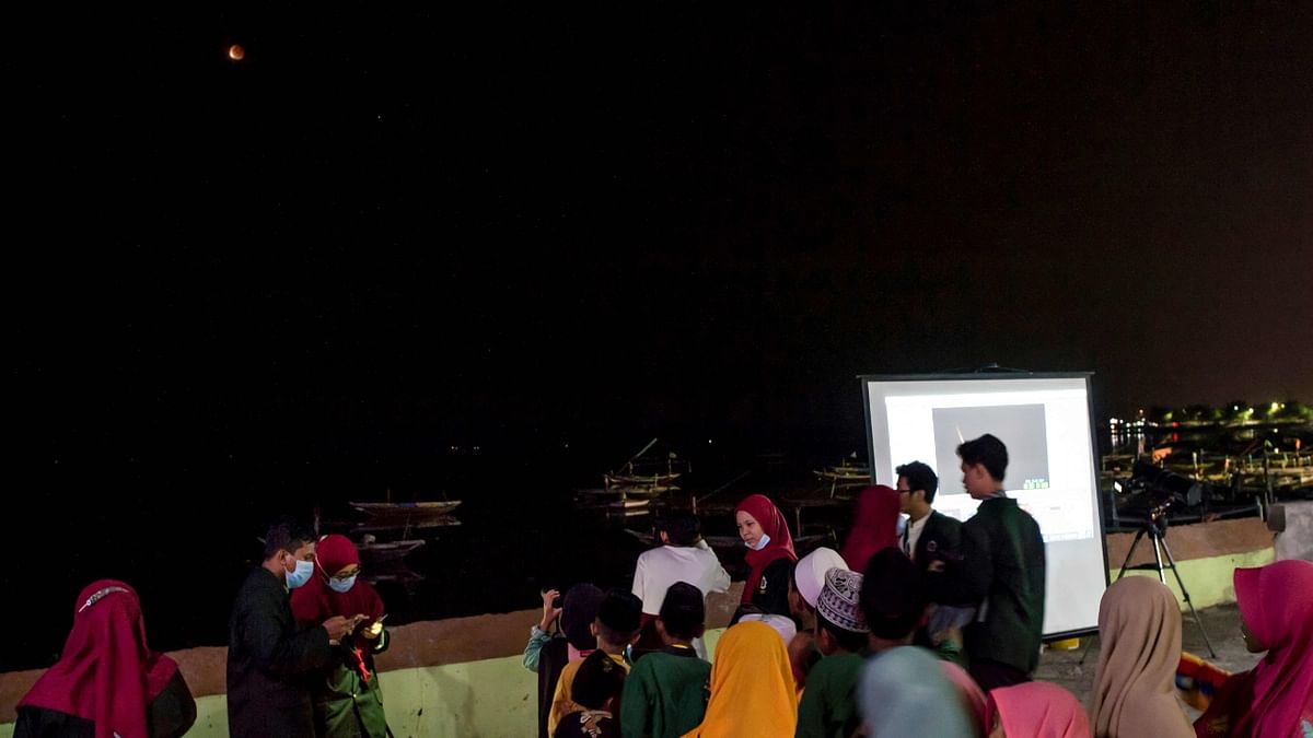 Skygazers experience the first total lunar eclipse of 2021 in Indonesia. Credit: AFP Photo