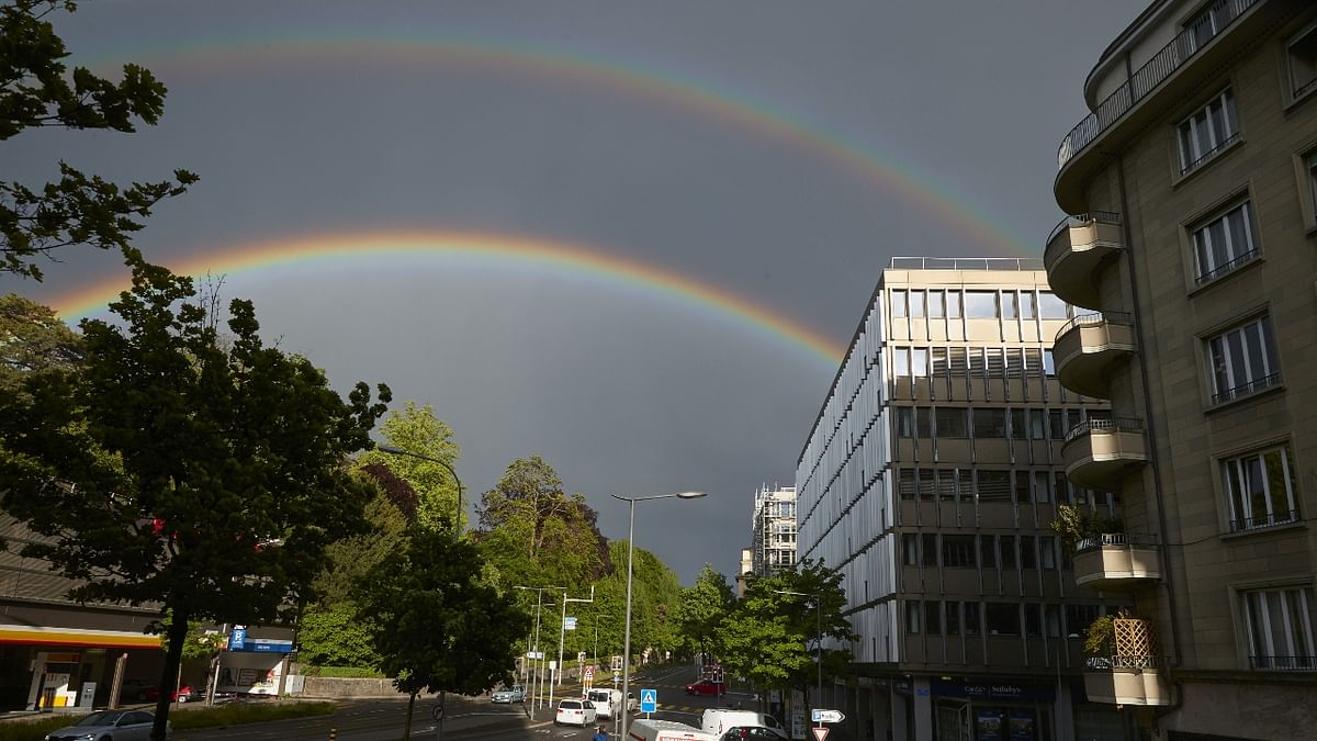 A mix of rain and sun on a spring evening in Switzerland with the opportunity to catch a few rainbows.