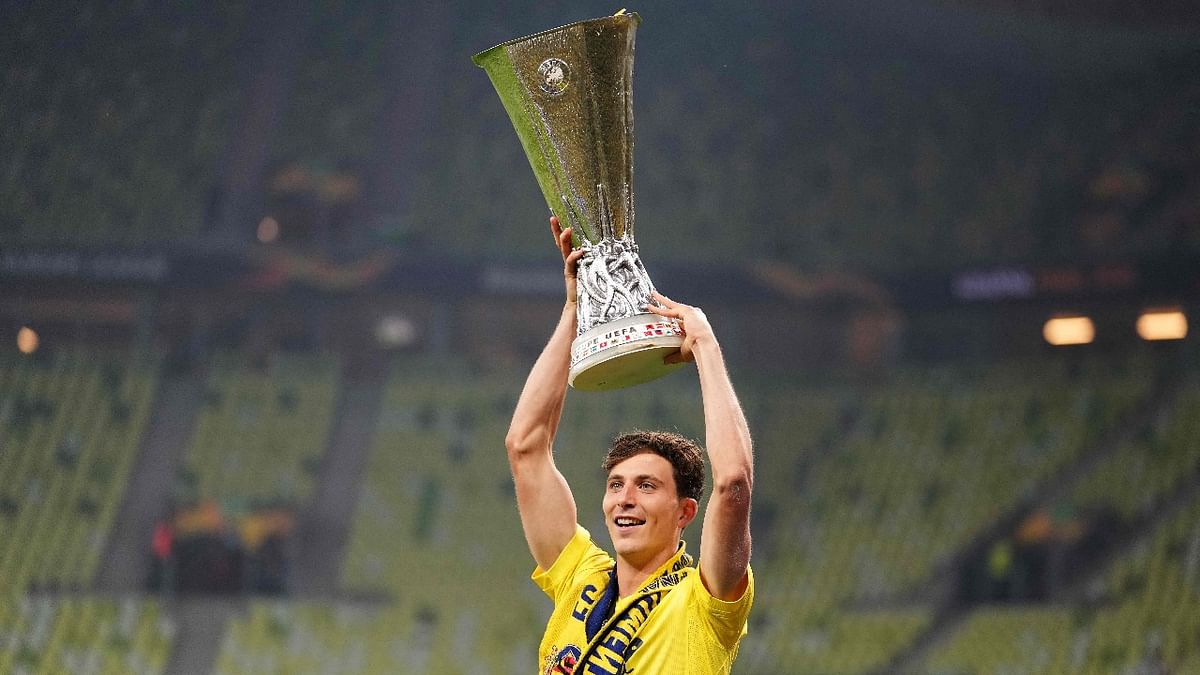 Villarreal's Spanish defender Pau Torres celebrates with the trophy after winning the UEFA Europa League final football match between Villarreal CF and Manchester United at the Gdansk Stadium in Gdansk. Credit: AFP Photo
