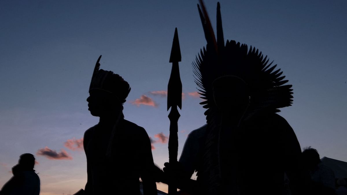 In this file photo taken on April 25, 2019 indigenous men are pictured at a protest camp in Brasilia. - Brazilian Mundurucu indigenous people denounced on May 26, 2021 having suffered new attacks after a police operation to expel illegal miners from their lands in the northern Para state. Credit: AFP Photo