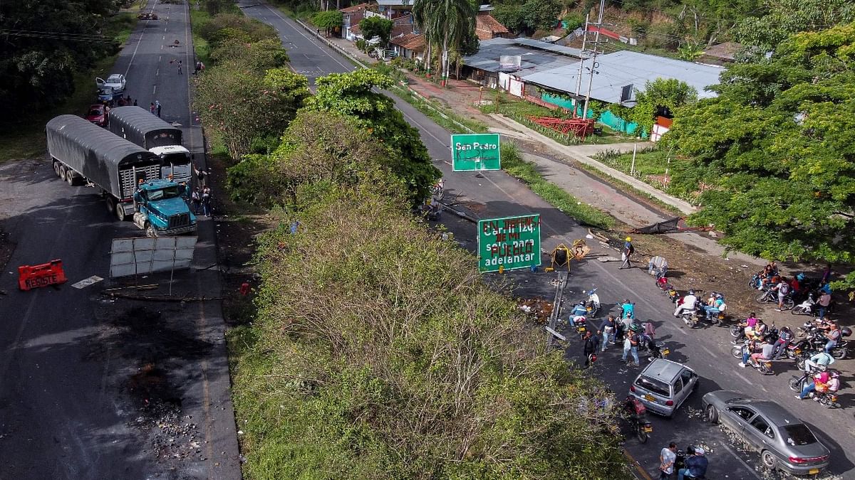 Aerial view of the Panamerican highway blocked to protest against the government of President Ivan Duque, between Buga and Cali, in Valle del Cauca department, Colombia. Credit: AFP Photo