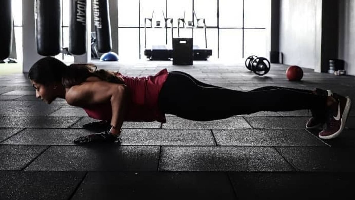 Sanjana is seen doing push-ups.