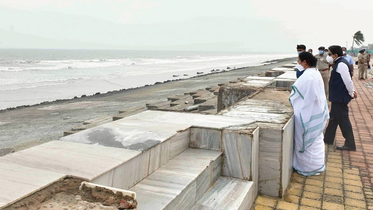 In this photo, West Bengal Chief Minister Mamata Banerjee is seen taking stock of damages in Digha.