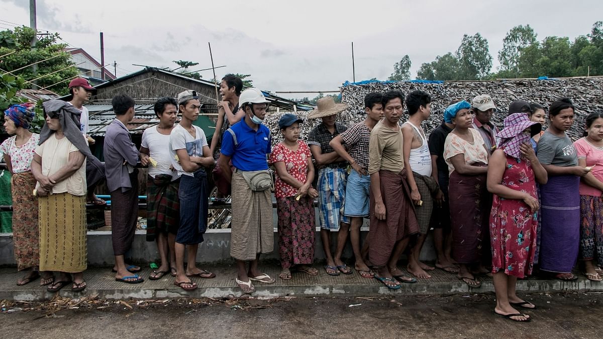 Millions queue up for food as military coup in Myanmar paralyses economy