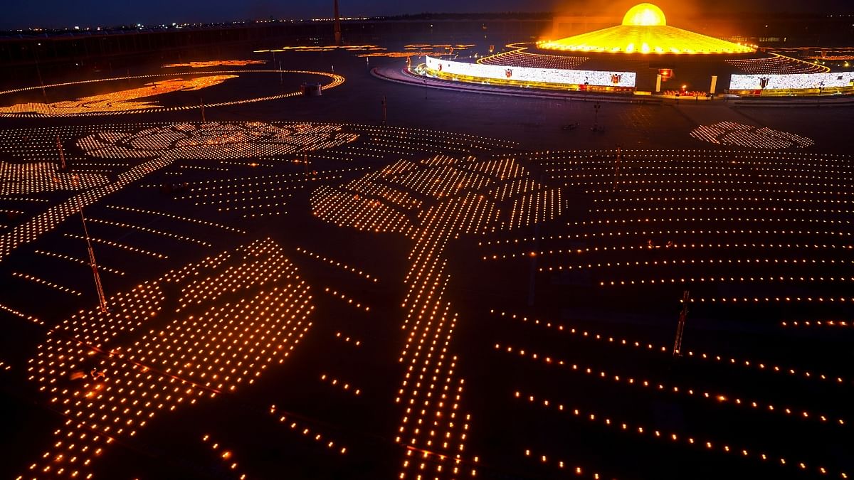 Candles are lit during Vesak Day at the Dhammakaya temple amid the coronavirus pandemic in Pathum Thani, Thailand.