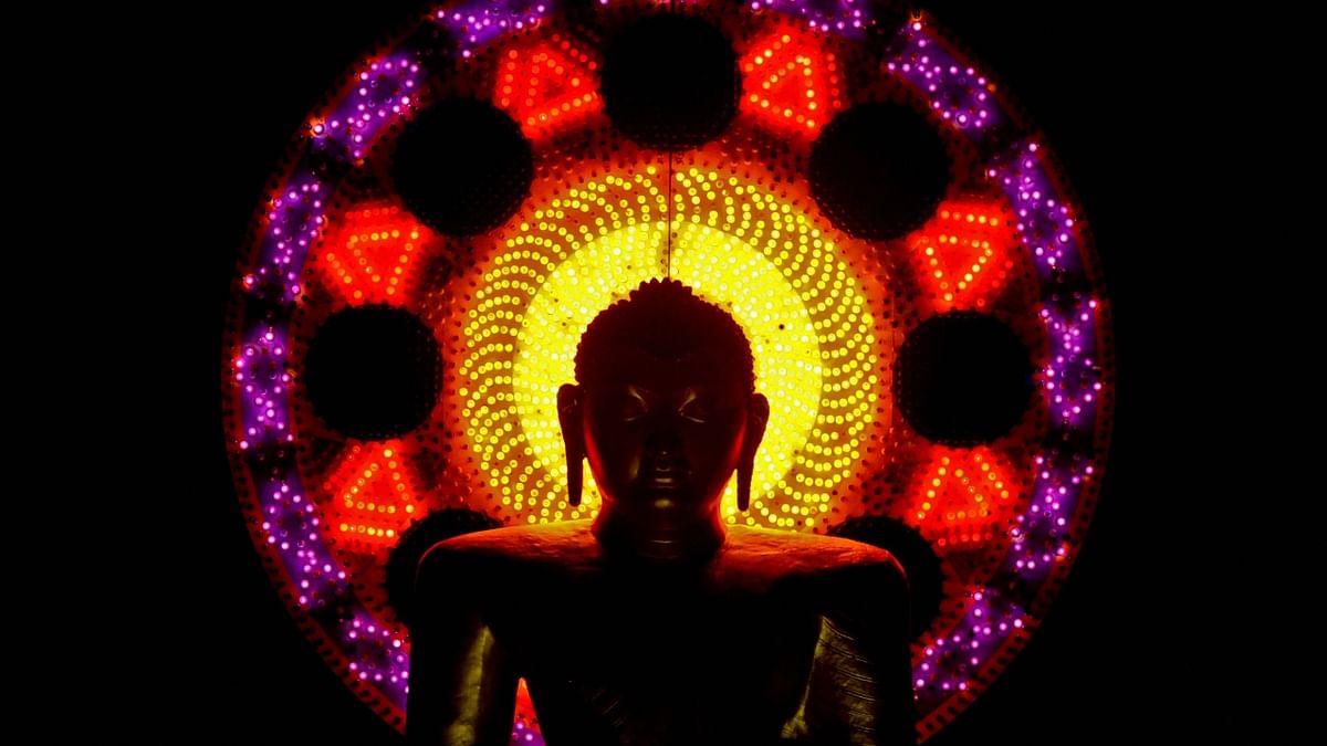An illuminated statue of Buddha, lit up using lanterns on Vesak Day at the Mahamevnawa Temple in Colombo.