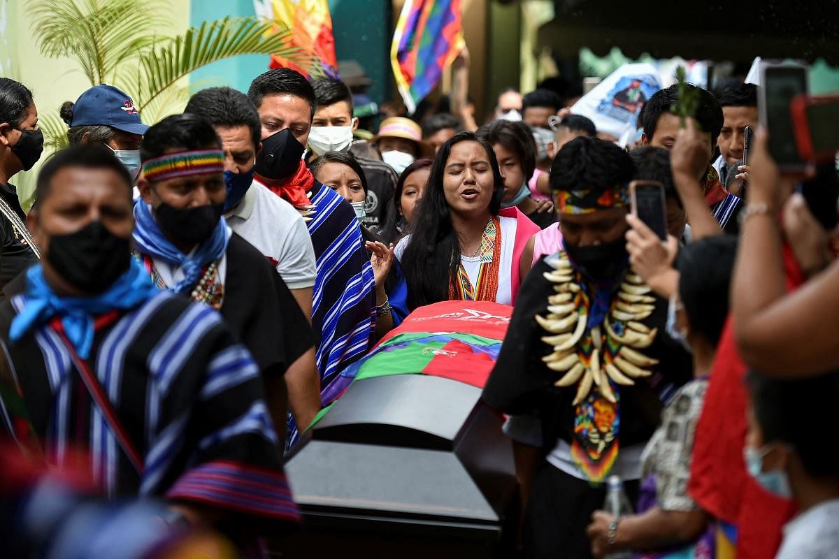 Relatives and friends carry the coffin of indigenous leader Sebastian Jacanamijoy, who was killed on May 28, 2021 during a protest against the government of Colombian President Ivan Duque, during the funeral in Cali, Colombia. Credit: AFP Photo