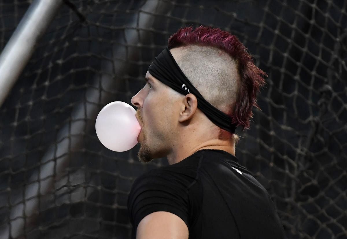 Josh Reddick #22 of the Arizona Diamondbacks blows a bubble while taking batting practice prior to a game against the New York Mets at Chase Field. Credit: AFP Photo
