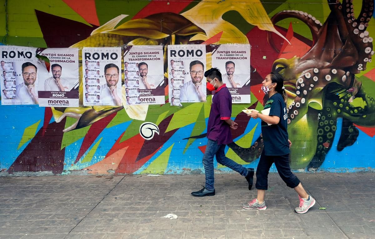 Electoral propaganda of Victor Hugo Romo, candidate for mayor of Miguel Hidalgo for the National Regeneration Movement (Morena) in coalition with the Labor Party (PT) and the Green Ecologist Party of Mexico (PVEM), is seen in Mexico City. Credit: AFP Photo