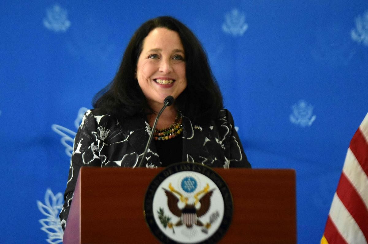 The new business manager of the United States Embassy in El Salvador, Jean Elizabeth Manes, speaks upon arrival at San Oscar Romero International Airport in San Luis Talpa, El Salvador. Credit: AFP Photo