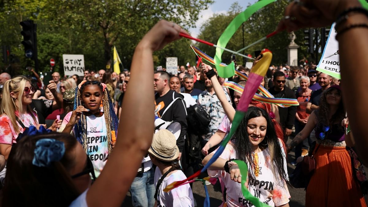 People chant slogans during an anti-lockdown and anti-vaccine protest in London.