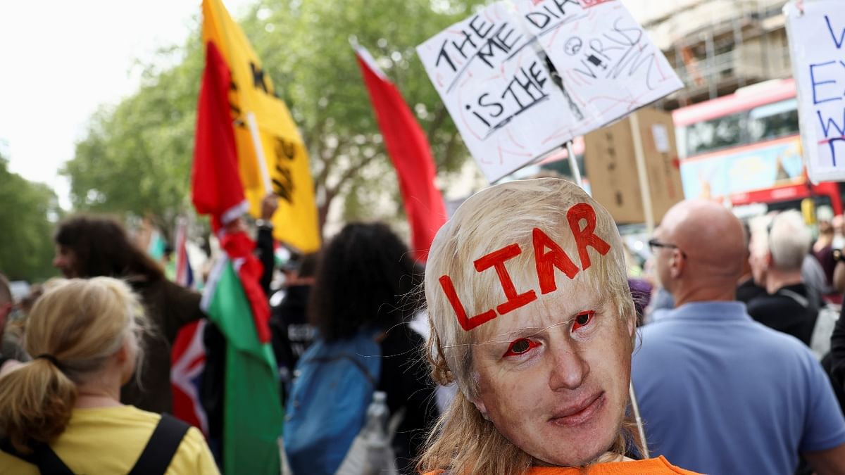 Demonstrators attend an anti-lockdown and anti-vaccine protest, amid the spread of the coronavirus disease (Covid-19), in London, Britain.