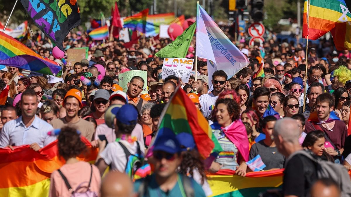 Thousands thronged to the streets of Jerusalem to take part in the Gay Pride march which was held under heavy security over fears of violence and a year after most of the globe's Pride events were called off due to the coronavirus pandemic. Credit: AFP Photo