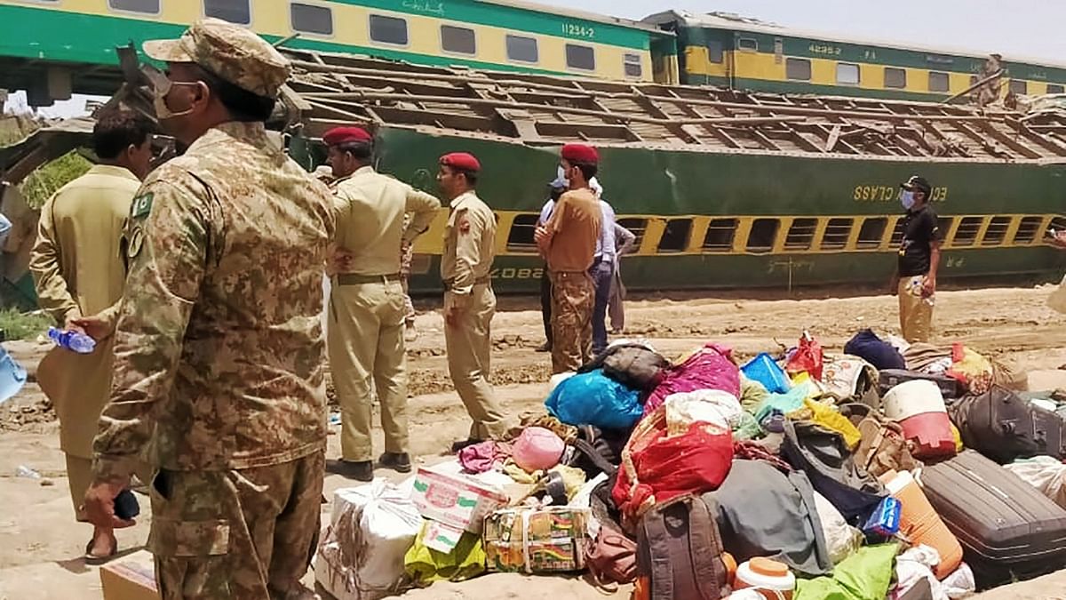 The death toll was likely to rise as rescuers struggled to reach people trapped in several mangled compartments strewn across the tracks in the southern province of Sindh. Credit: AFP