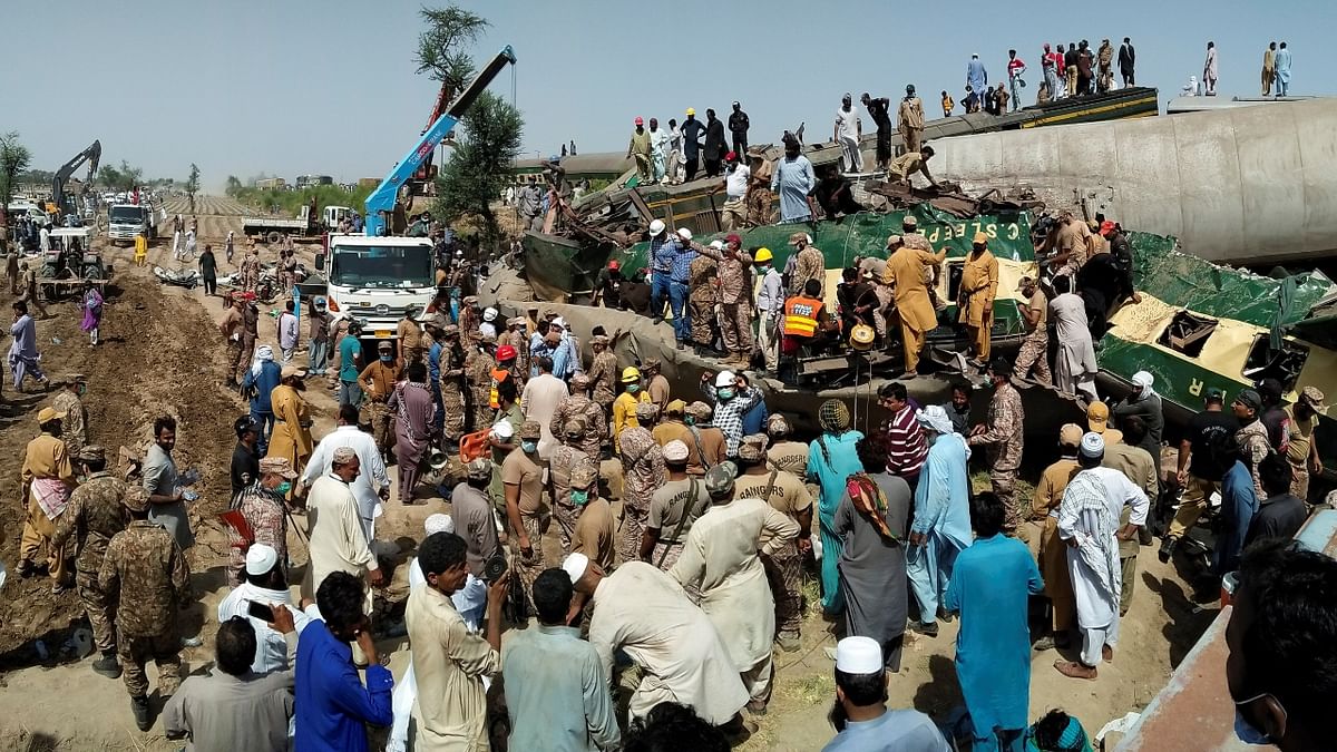 The image shows paramilitary soldiers and workers at the site of the accident in Ghotki, Pakistan. Credit: Reuters Photo