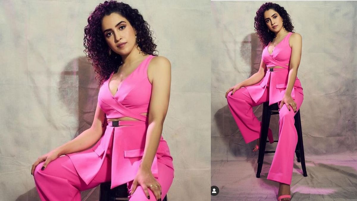 Barbie pantsuit: Donning a hot pink pantsuit, the Dangal star looks no less than a Barbie in this outfit. This suit stands out with the cut around the waist giving it a super chic look paired with pink chunky heels.