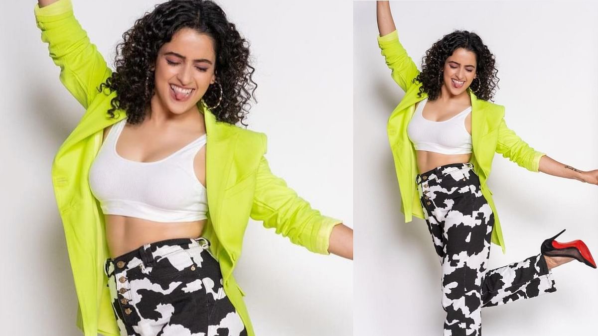 The Cow print pants: Sanya looks uber cool in the very rare cow print on her pants which she has paired with a white sports bra and a neon yellow blazer and black stilletos. This is the go to look for a day out with your girl friends or by yourself, just know you are rocking the fashion game.