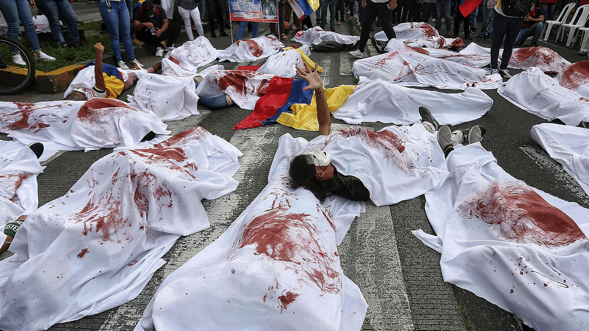 Demonstrators performance to pay tribute to the victims of police violence in the framework of the protests against the government of the Colombian President Ivan Duque during the visited of the Inter-American Comission on Human Rights (CIDH) in Cali, Colombia. Credit: AFP Photo