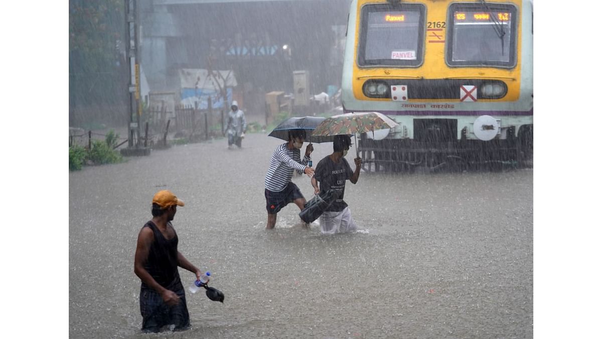 Heavy rains lashed Mumbai and its suburbs, causing flooding on roads and rail tracks and disrupting suburban train services as the southwest monsoon arrived in the city with a bang. Credit: Reuters Photo