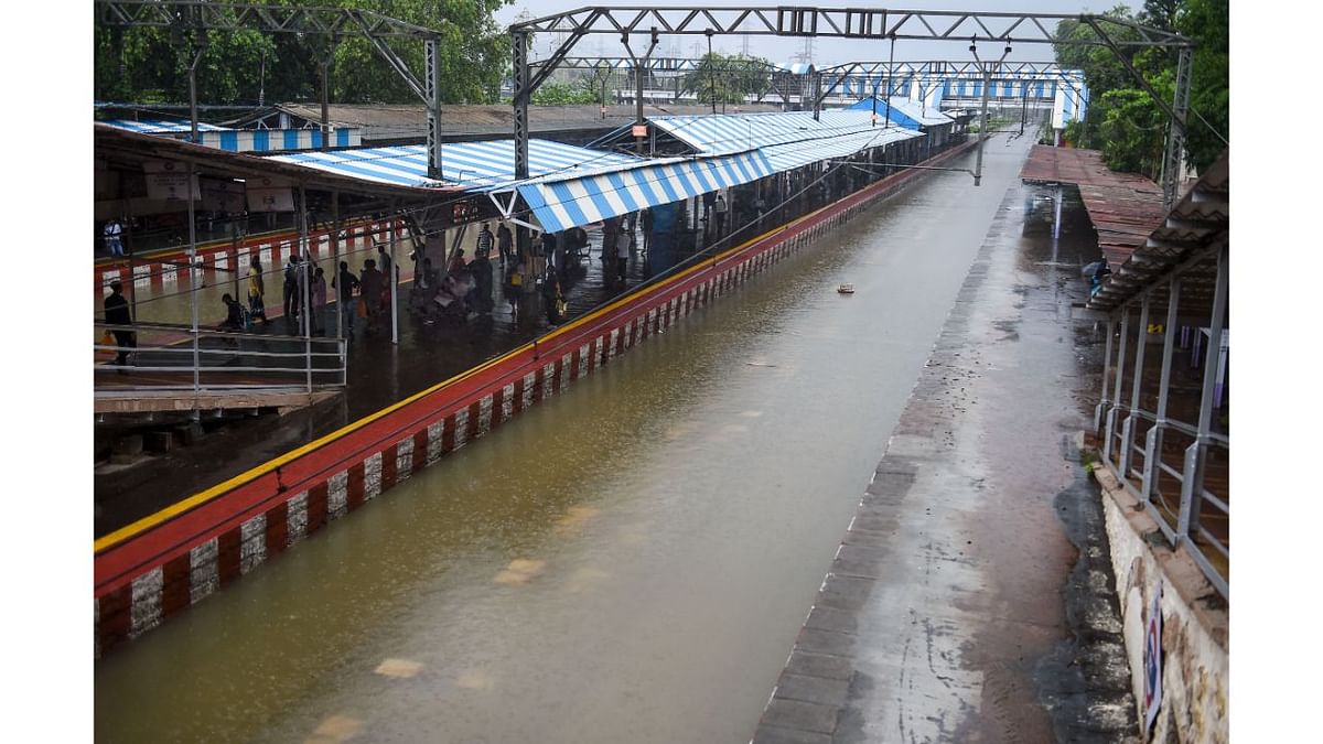 Railway track submerged in rainwater during rain, at Chunabhatti railway station, in Mumbai. Credit: PTI Photo