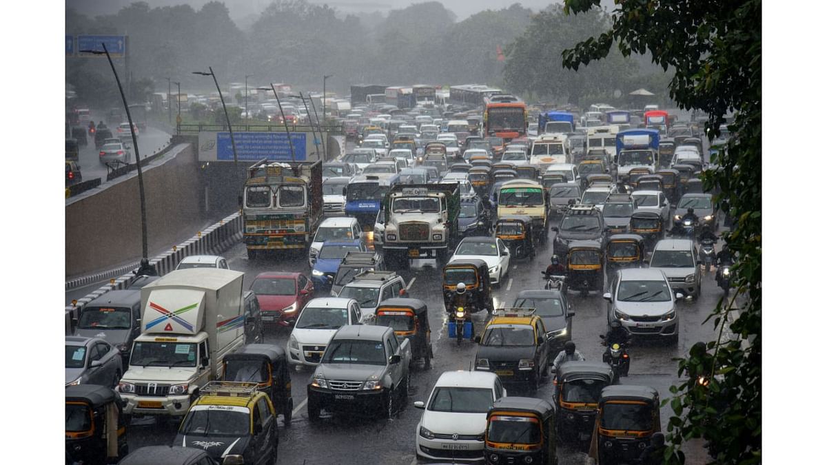 The first rains of this year's monsoon season in Mumbai caused water-logging in various parts of the city, prompting the traffic police to shut four subways and forcing motorists to abandon their vehicles on roads. Credit: PTI Photo