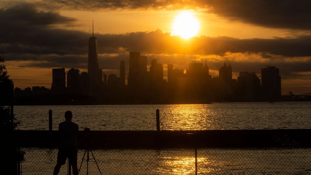 The New York skyline is seen as the Moon partially covers the sun during a partial solar eclipse in New Jersey. Credit: AFP Photo