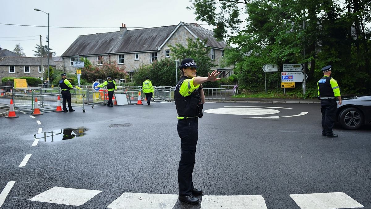 Police officers work at a roadblock on the outside of Carbis Bay as security preparations are underway for the G7 leaders summit, Cornwall, Britain. Credit: Reuters Photo