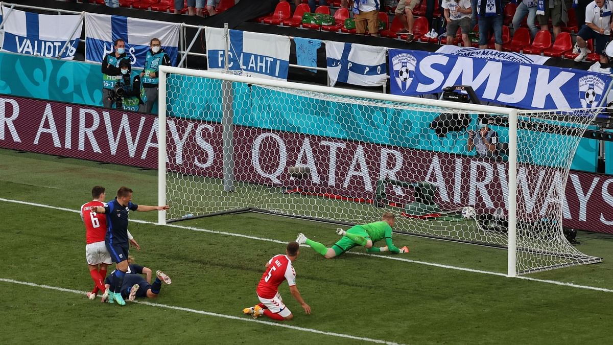 Finland's Joel Pohjanpalo scores their first goal past Denmark's Kasper Schmeichel. Credit: Reuters Photo