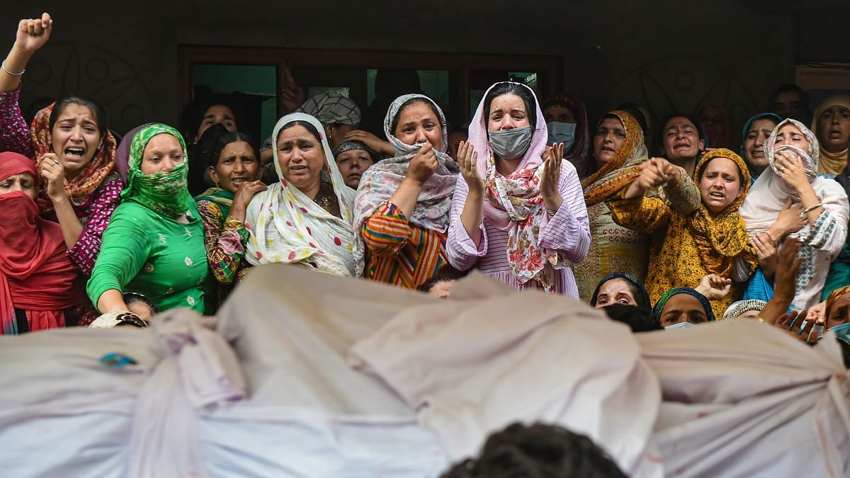 Relatives mourn the death of Policeman Waseem Ahmad during funeral procession, who was killed in a militant attack at Sopore town in Baramulla district of North Kashmir, at DPL in Srinagar. Credit: PTI Photo