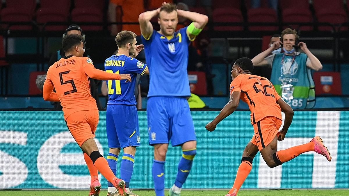 Euro 2020: Netherlands' defender Denzel Dumfries (R) celebrates after scoring the winning goal against Ukraine. Credit: AFP Photo