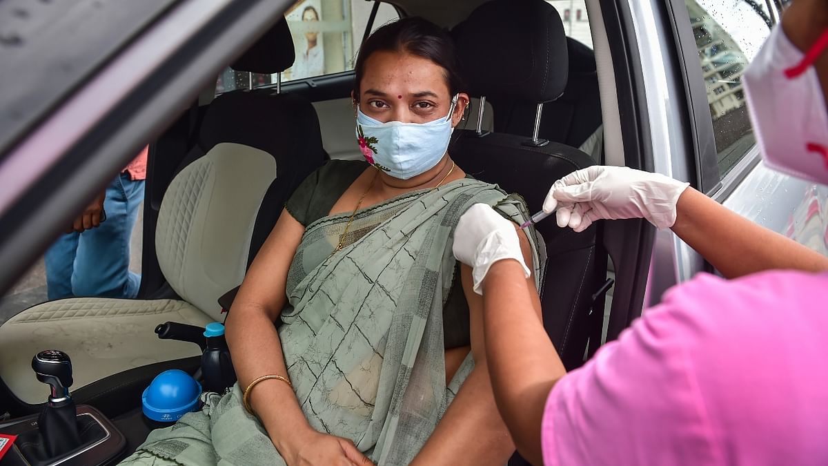 Hundreds of people got vaccinated in a drive-through vaccination camp organised at Vega City Mall, Bannerghatta Road in Bengaluru. Credit: PTI Photo