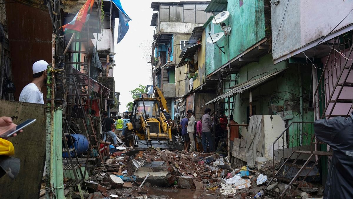 At least 12 people, including eight children, were killed and seven others injured after two floors of a three-storey residential building collapsed on an adjoining single-storey house in Malwani in suburban Mumbai.
