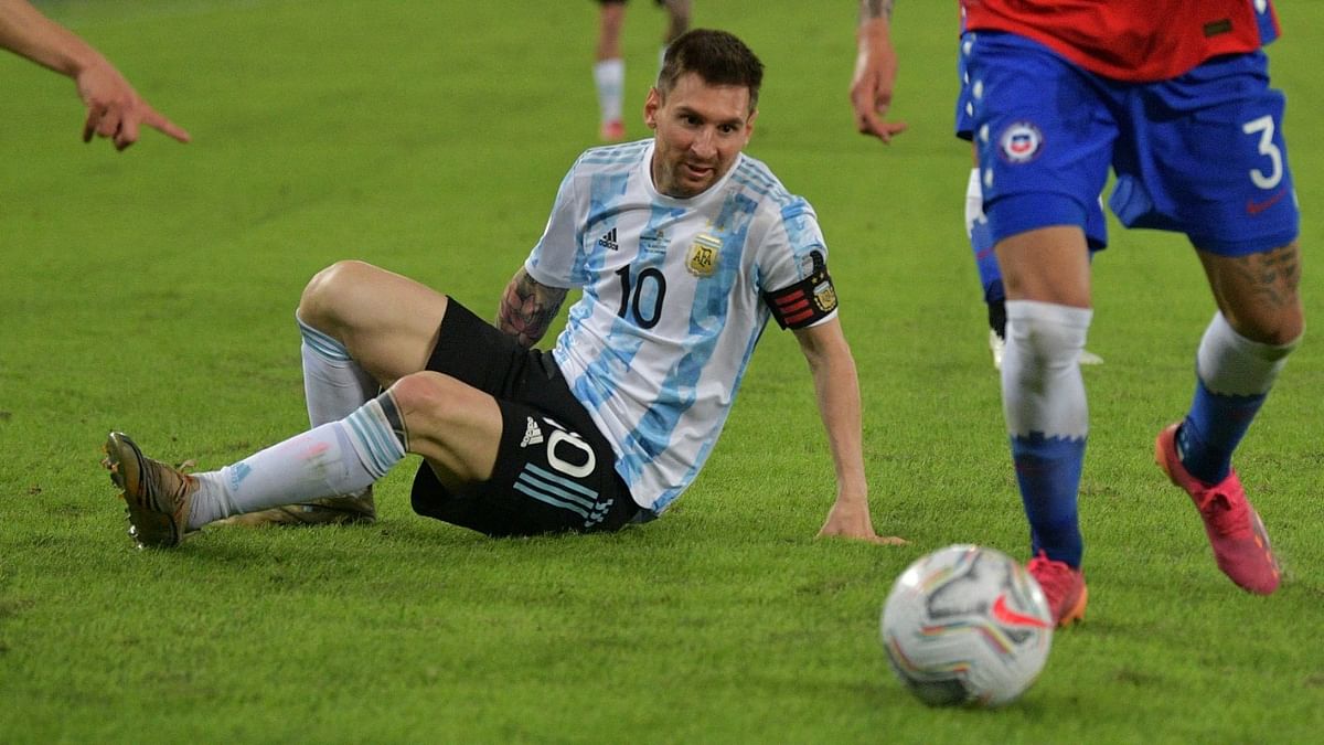 Argentina's Lionel Messi falls during the Conmebol Copa America 2021 football tournament group phase match against Chile at the Nilton Santos Stadium in Rio de Janeiro, Brazil. Credit: AFP Photo