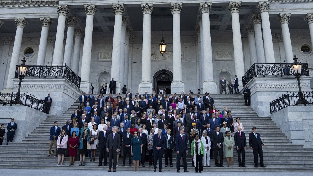 Members of Congress hold a moment of silence for the 600,000 American lives lost to Covid-19, on the steps of the US Capitol. Credit: AFP Photo
