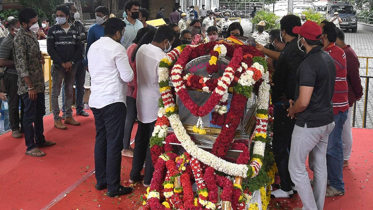 Friends and relatives are seen paying their last respects at Ravindra Kalakshetra campus.