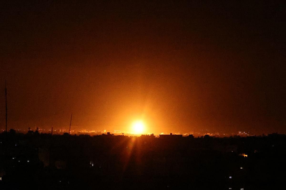 Explosions light-up the night sky at Khan Yunis in the southern Gaza Strip, as Israeli forces shell the Palestinian enclave. Credit: AFP Photo