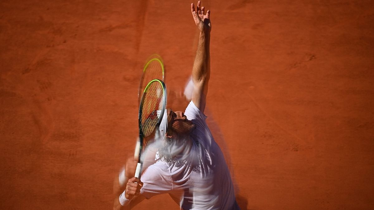 Greece's Stefanos Tsitsipas serving the ball to Serbia's Novak Djokovic during their men's final tennis match on Day 15 of The Roland Garros 2021 French Open tennis tournament in Paris. Credit: AFP Photo