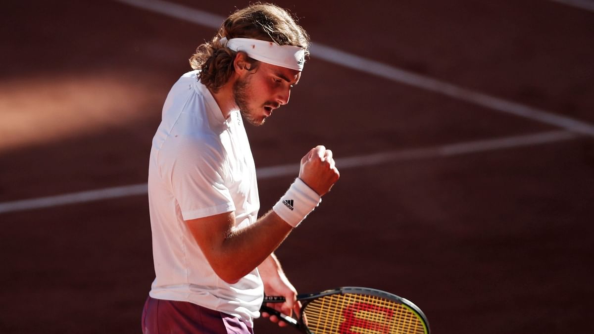 Greece's Stefanos Tsitsipas reacts after scoring a point against Serbia's Novak Djokovic. Credit: Reuters Photo
