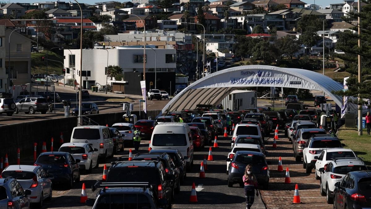 Vehicles wait in line at the Bondi Beach drive-through coronavirus disease (COVID-19) testing centre in the wake of new positive cases in Sydney, Australia. Credit: Reuters Photo