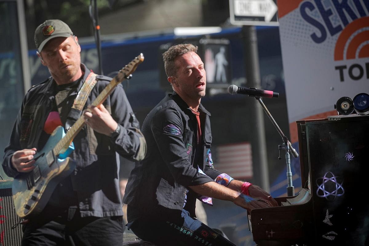 Singer Chris Martin and lead guitarist Johnny Buckland perform with their band Coldplay on NBC's Today show in New York. Credit: Reuters Photo
