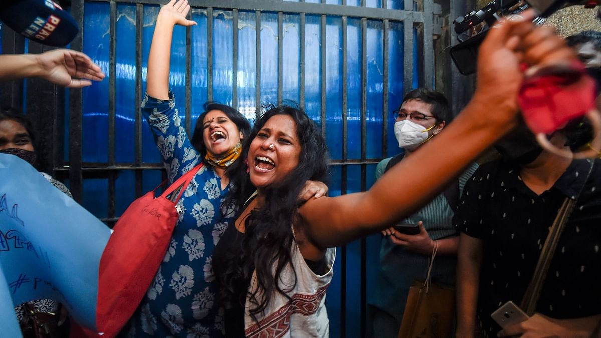 Devangana Kalita and Natasha Narwal shout slogans after being released from Tihar jail in New Delhi. Credit: PTI Photo