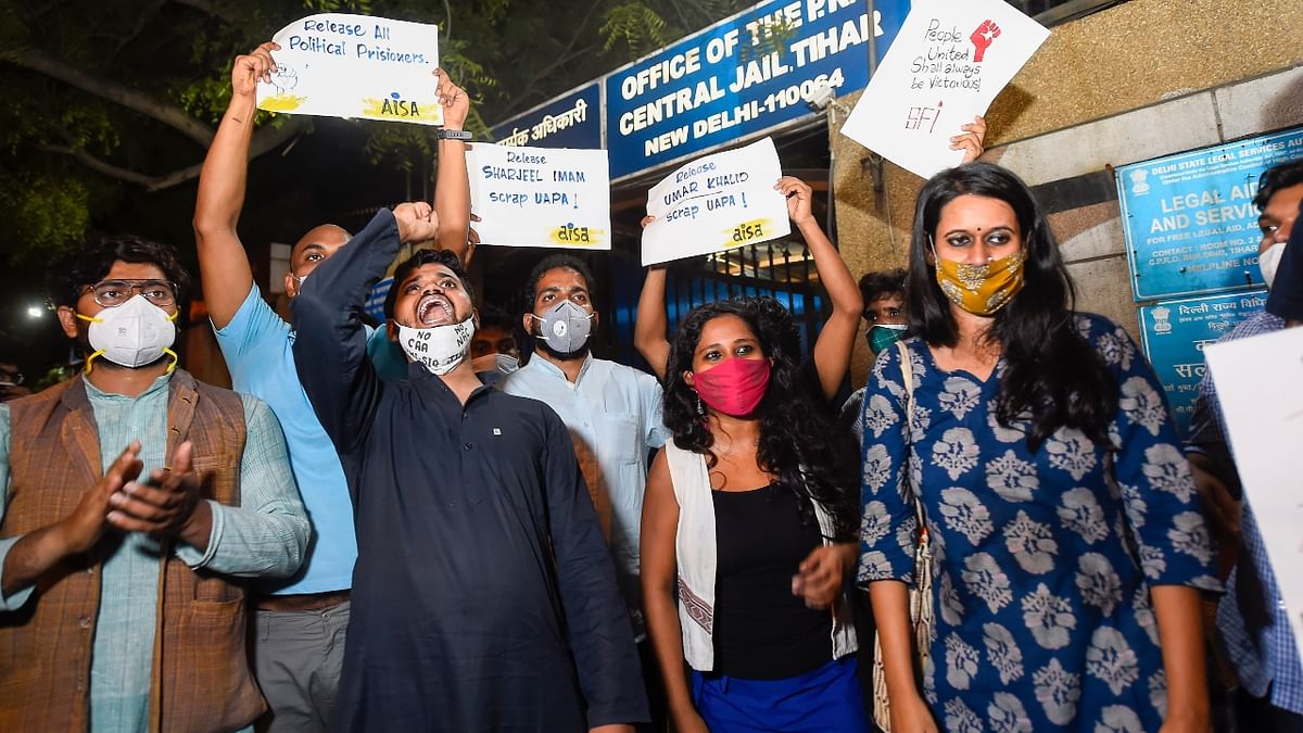 Devangana Kalita and Natasha Narwal and other activists shout slogans after being released from Tihar jail in New Delhi. Credit: PTI Photo