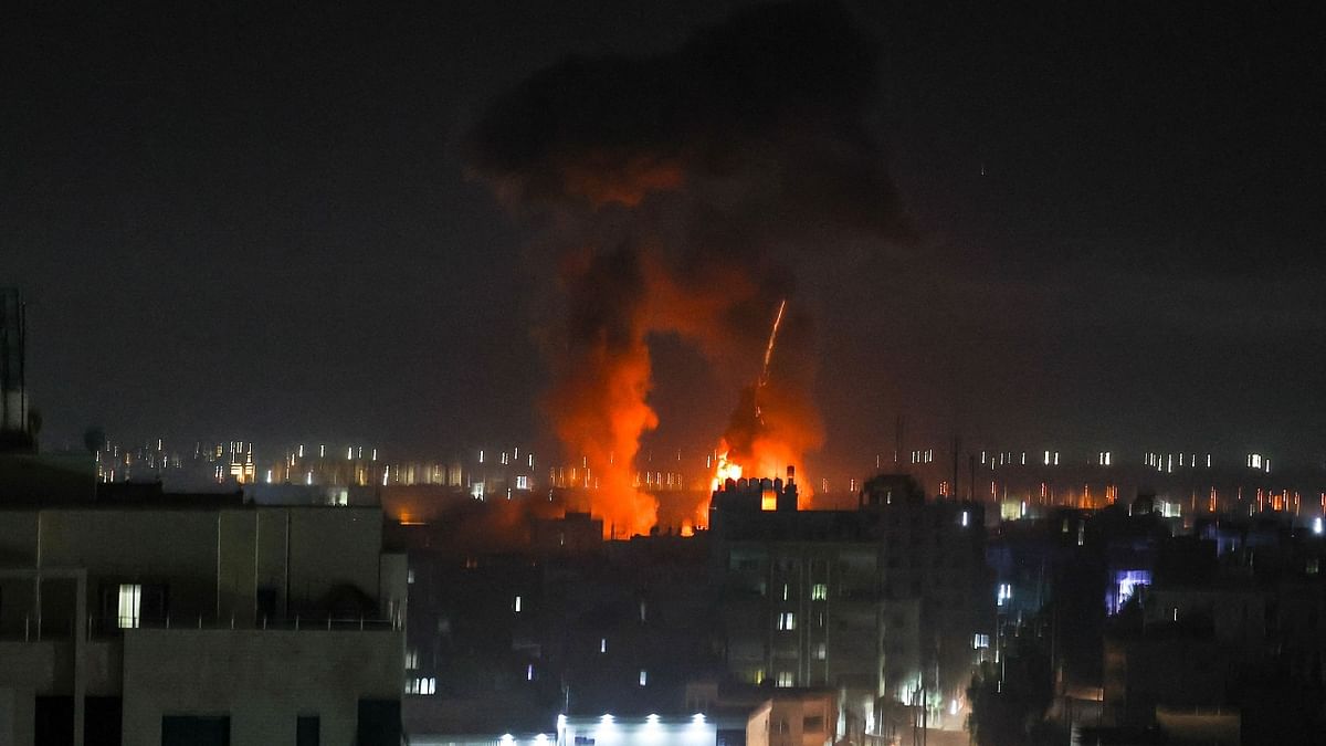 Soon after the strikes, Hamas militants opened fire with heavy machine guns towards the Jewish state, as Israeli warning air raid sirens rang out. Credit: AFP Photo