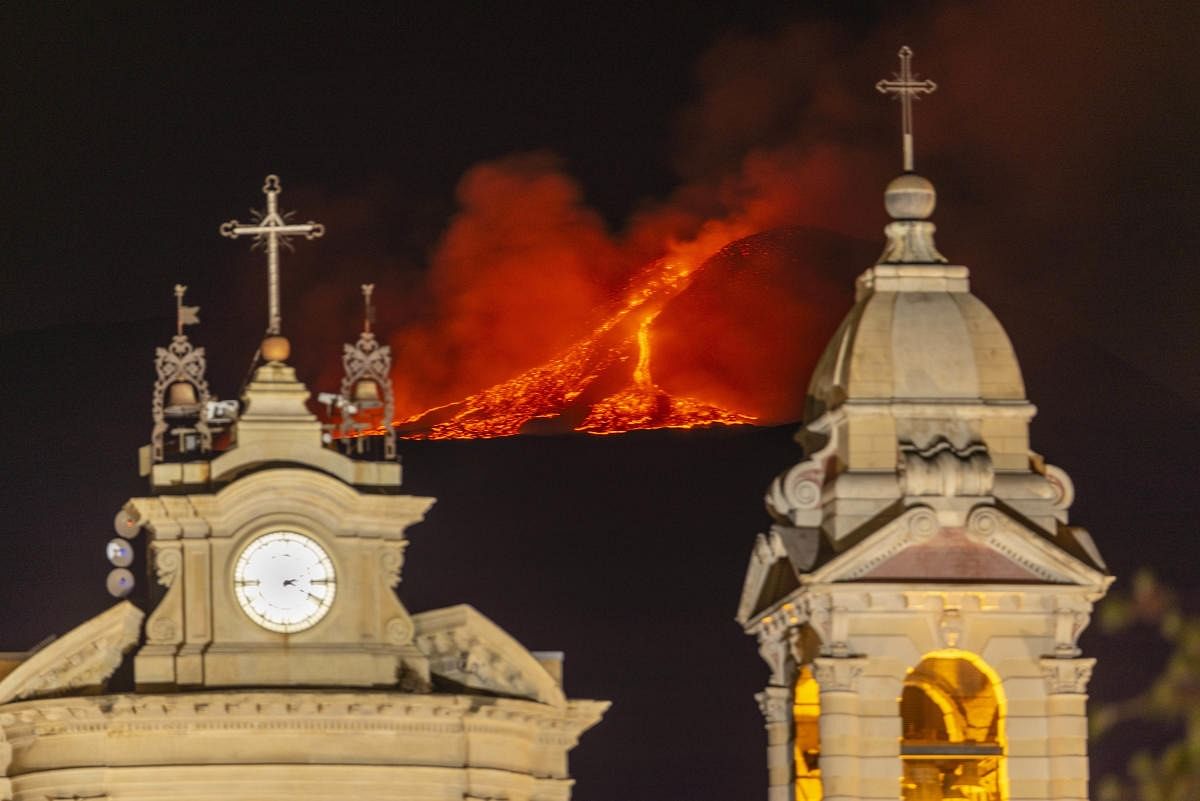 Lava erupts from a crater of Mt. Etna, Europe's largest active volcano, behind Santa Maria della Guardia church in Belpasso, near Catania, in southern Italian island of Sicily. Credit: AP Photo