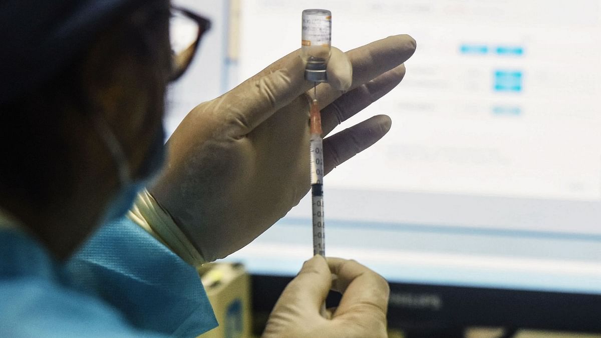 This photo taken on June 20, 2021 shows a medical worker preparing a dose of the China National Biotec Group (CNBG) Covid-19 coronavirus vaccine in Hangzhou, in China's eastern Zhejiang province. Credit: AFP Photo