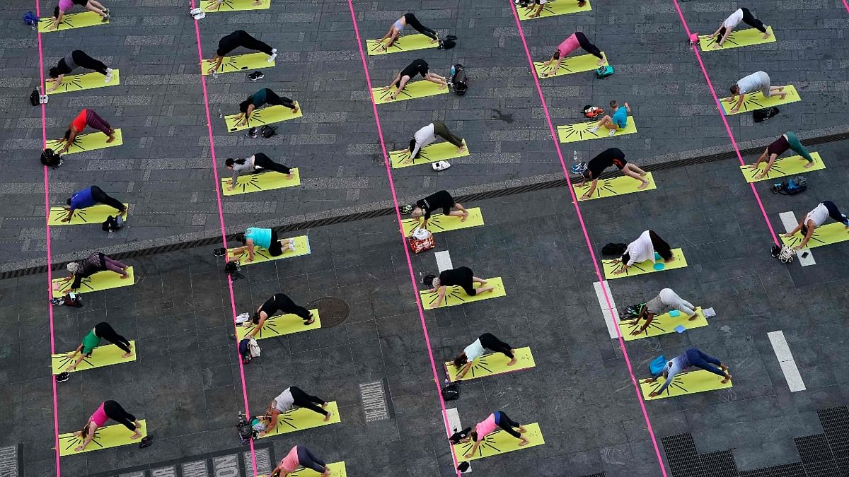 International Yoga Day 2021: Over 3,000 Yogis roll out mats at iconic Times Square; See Pics