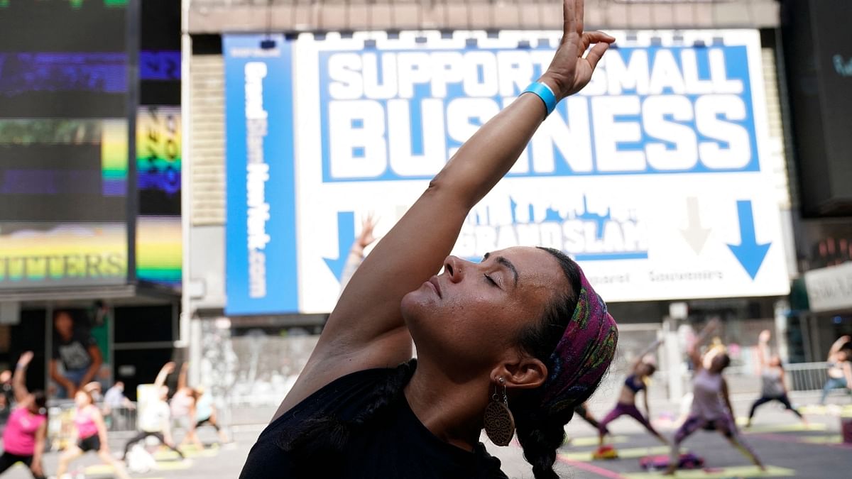 People practice yoga at Times Square in New Jersey. Credit: AFP Photo