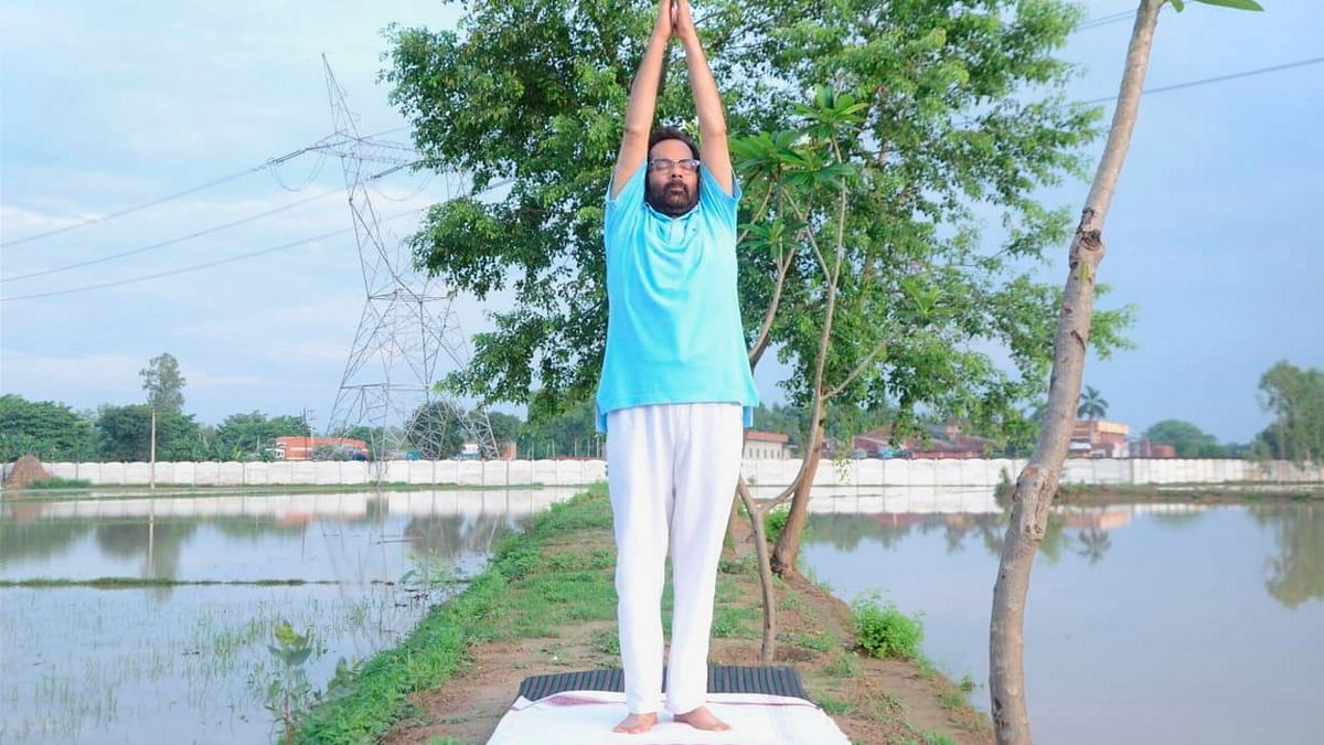 Union Minister for Minority Affairs Mukhtar Abbas Naqvi performs yoga on International Day of Yoga, at Rampur. Credit: PTI Photo