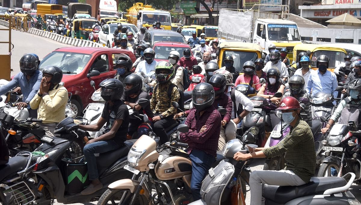 JC Road and Town Hall saw heavy traffic movement after Coovid-19 restrictions were eased in Karnataka after over two months. Credit: DH Photo/SK Dinesh